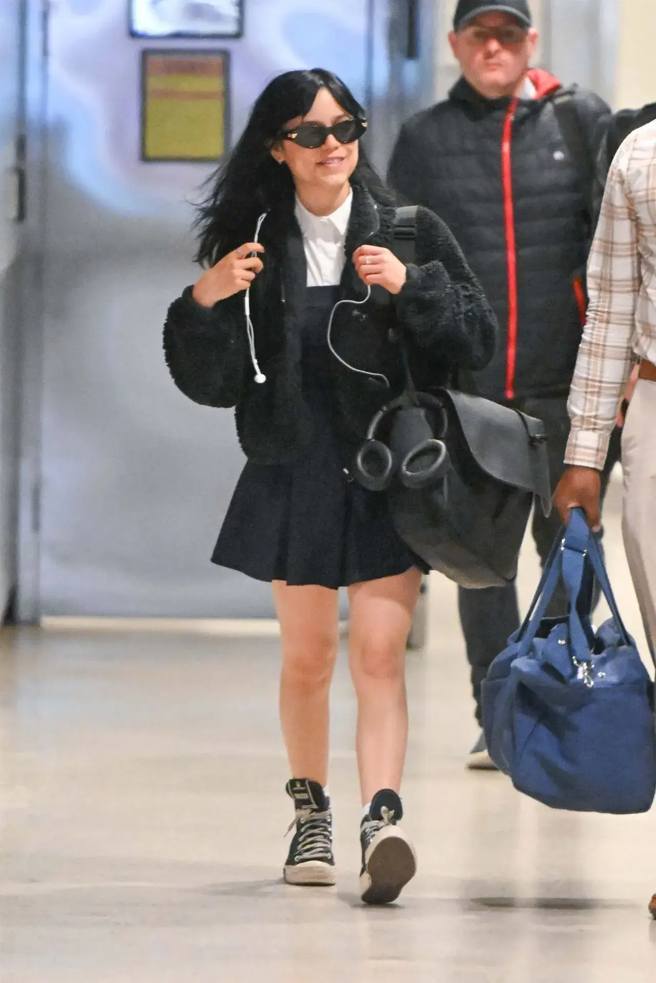 American actress Jenna Ortega Stills in Blue dress at JFK Airport